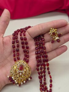 Red beads mala with locket
